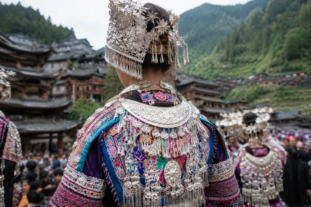Traditional embroidered clothing and silver jewelry worn during a Miao ethnic minority festival in China
