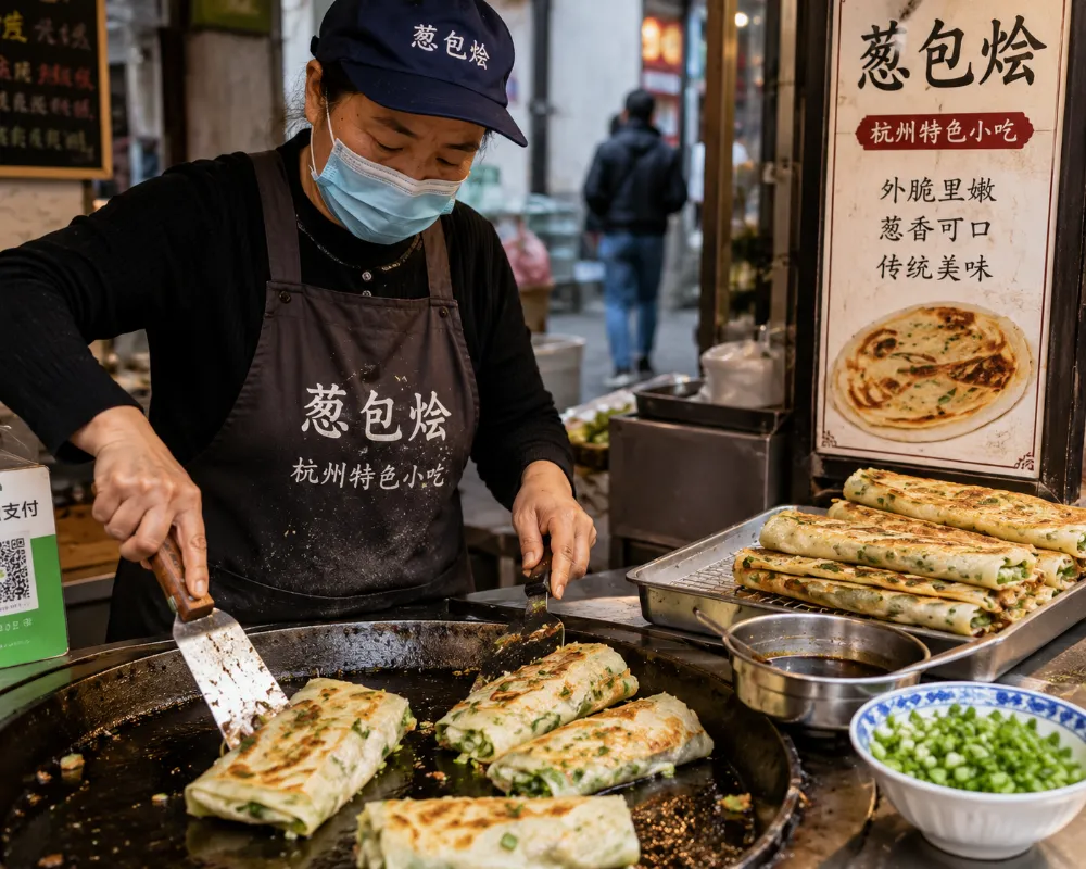 Street vendor preparing Congbao Kuai'er scallion pancake in Hangzhou